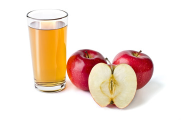 Glass of apple juice and red apples lying next isolated over whi