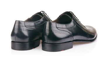 Fashion concept with male shoes on white