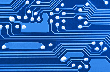 Close up of a printed blue computer circuit board