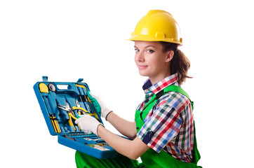 Young woman with toolkit on white