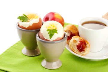 Light breakfast with boiled eggs and cup of coffee, isolated