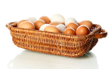 Many eggs in basket isolated on white