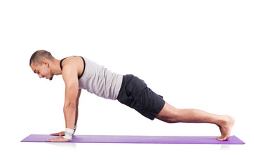 Man doing exercises on white