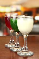 Tasty color liquors, on bright background