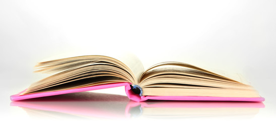 Opened book isolated on white