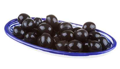 Olives black watered with olive oil in a bowl isolated on a whit