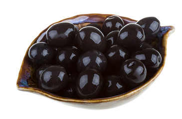 Olives black watered with olive oil in a bowl isolated on a whit