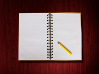 Open blank note book on wood