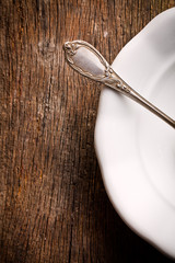 detail of vintage cutlery on white plate