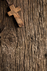 antigue wooden cross on old wooden background © Jiri Hera