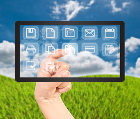 Hand pushing button on tablet screen.