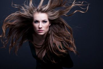 young beauty woman with flying hair