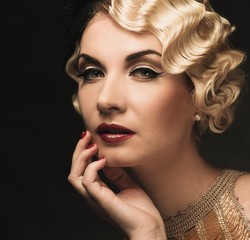 Elegant blond retro woman  in golden dress