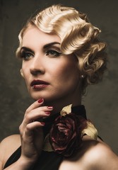 Elegant blond retro woman  in black dress