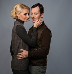 Young man and woman in casual brown wear