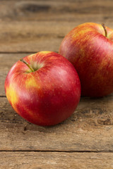 Red apples on a wooden table
