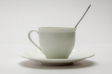 Fototapeta premium White coffee cup with spoon