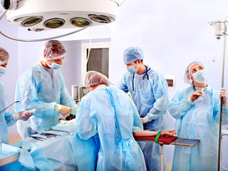 Surgeon at work in operating room.