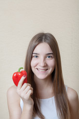 beautiful girl with red sweet pepper