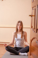 yoga meditation pretty blond in studio