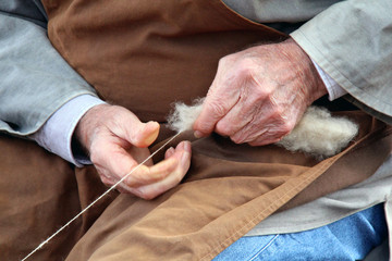 Old hands who spin the whitw wool