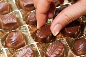 Chocolate sweets on the hand