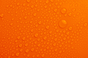 Water drops on orange background
