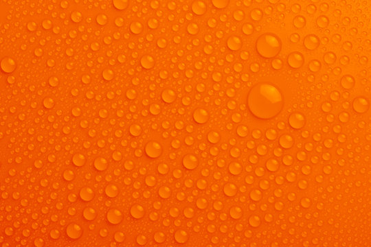 Water drops on orange background
