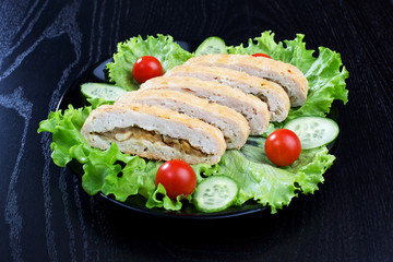 Chicken roll, lettuce, tomatoes and cucumbers