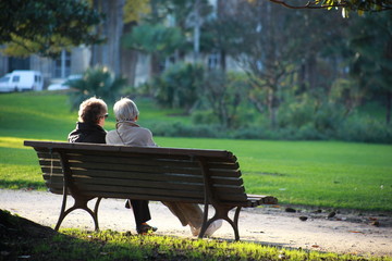 Two senior sat on a bench
