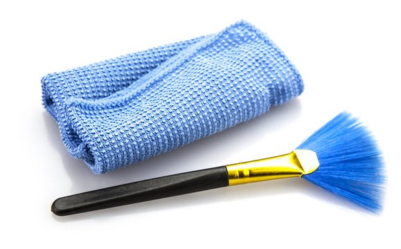 Comper Dust cleaingr brush and cloth on white background