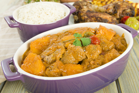 Lamb & sweet potato peanut stew with  rice & jerk chicken.