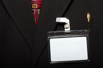 close up of blank id card on man's suit