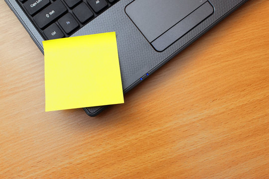 Blank Orange Post It Notes On A Laptop PC