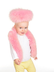 cute baby girl dressed in pink fur play on white background
