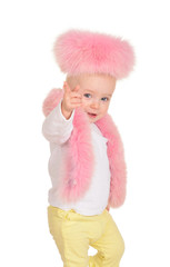 cute baby girl dressed in pink fur play on white background