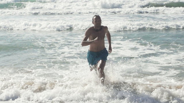 Man running out of the sea, super slow motion, shot at 480fps
