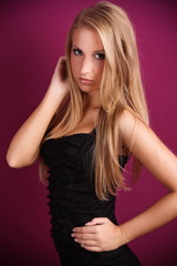 Fototapeta premium beautiful blond woman with violet background