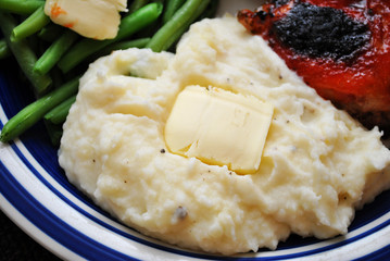 Side Dish of Mashed Potatoes with a Pat of Butter