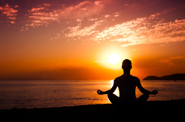 Yoga meditation at sunset