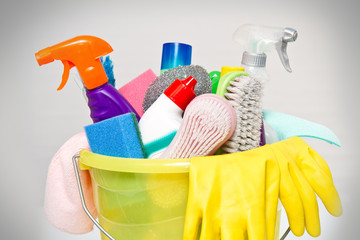 full box of cleaning supplies and gloves isolated on white