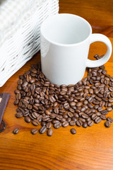 Coffee beans, cup and basket