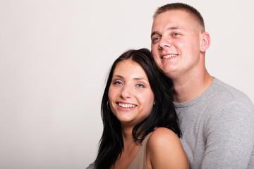 Portrait of a beautiful young happy smiling couple isolated