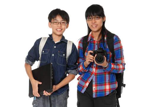 Couple children with a camera with laptop
