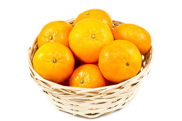 Tangerines (mandarin)  in a straw cup