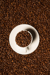 cup with coffee beans on a dark background