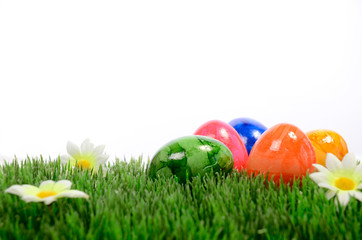 Fototapeta na wymiar Colorful Easter eggs on a green meadow