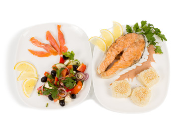 Salmon steak served with accompaniments