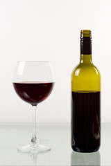 Bottle and glass of red wine