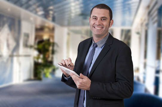 Businessman using digital tablet in office